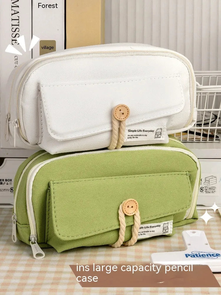 Large capacity canvas pencil case in green, holding multiple pens, simple Korean style design.