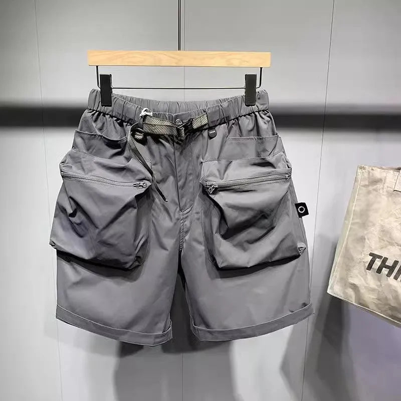 Men's black workwear shorts with multiple pockets and loose fitting design