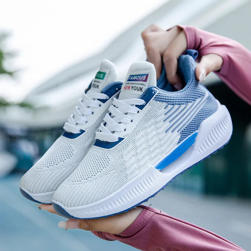 Men's blue casual sports mesh shoes with cloth upper and round toe design on a white background.
