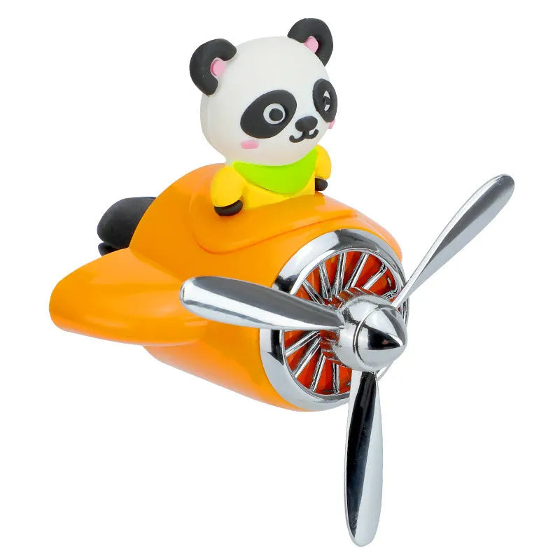 Cartoon aeroplane-shaped plastic clip for car air vent, includes fragrance slices, in black, blue, orange, or pink.