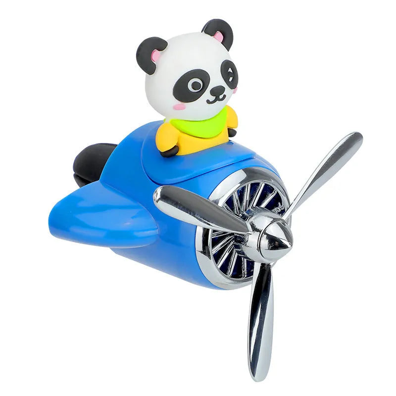 Cartoon aeroplane-shaped plastic clip for car air vent, includes fragrance slices, in black, blue, orange, or pink.
