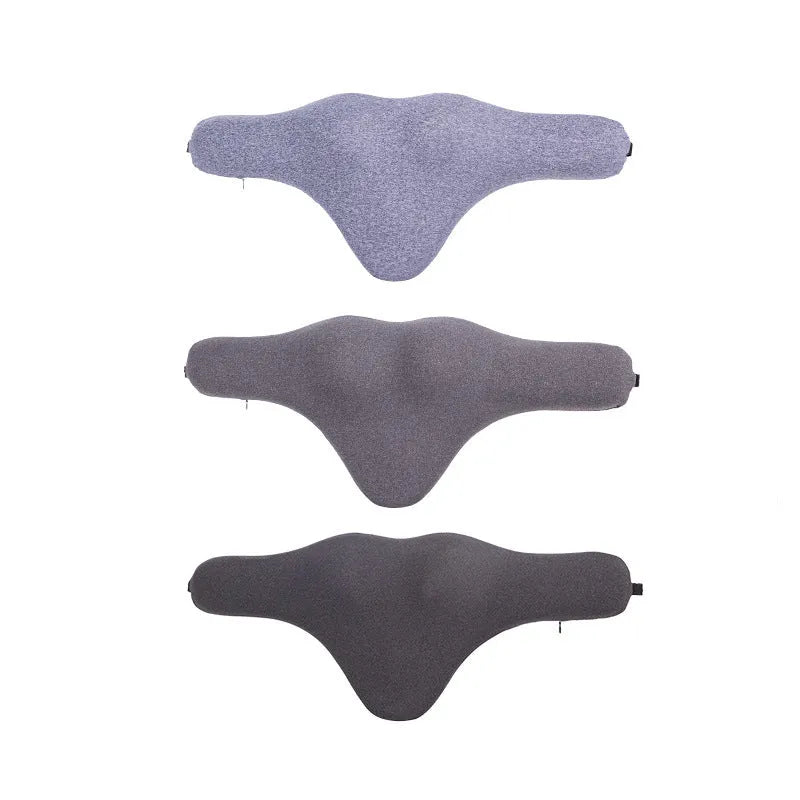Dark grey car neck memory pillow on a headrest showing its simple rectangular shape.