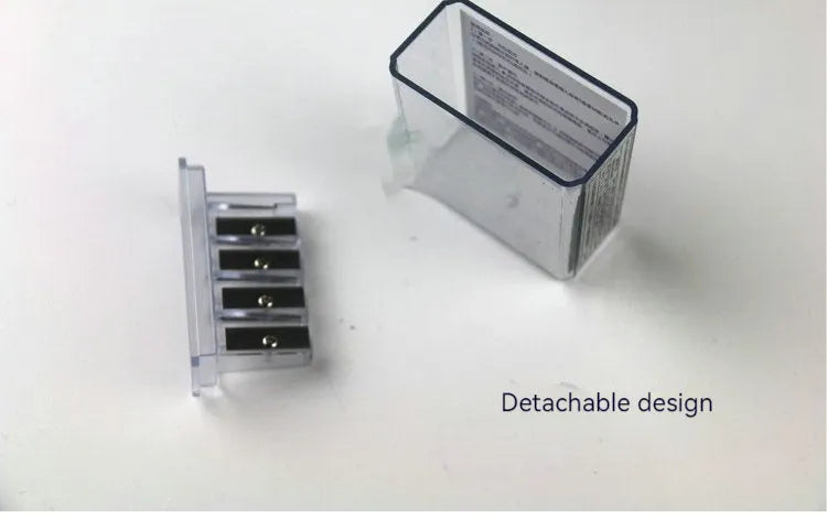 Four-hole pencil sharpener with geometric plastic design and replaceable blade system
