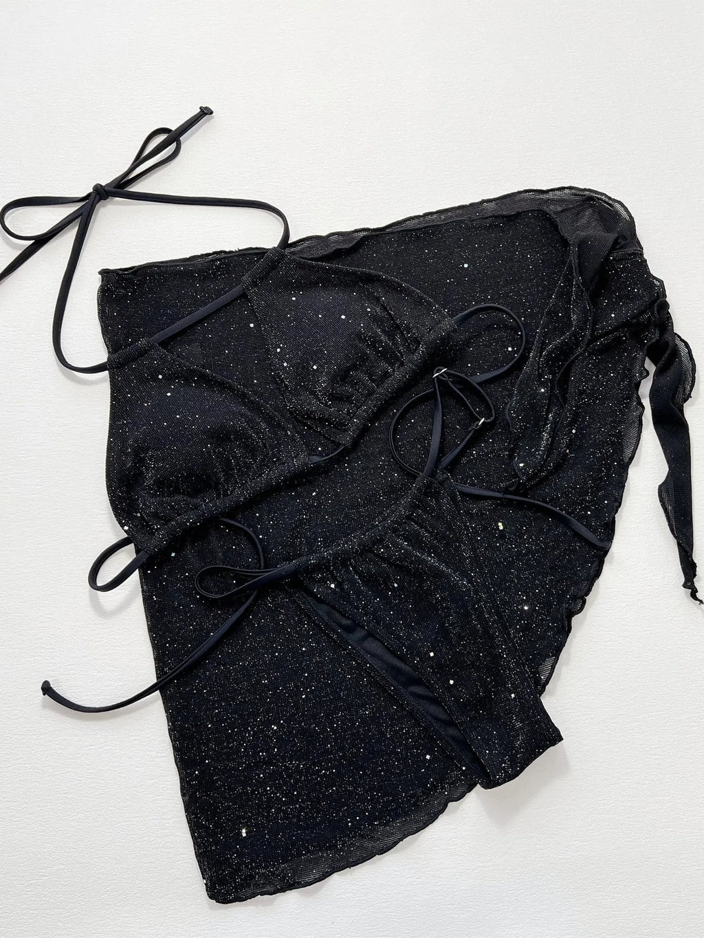 Black three-piece bikini swimsuit set with polyester fabric, showing top and shorts components