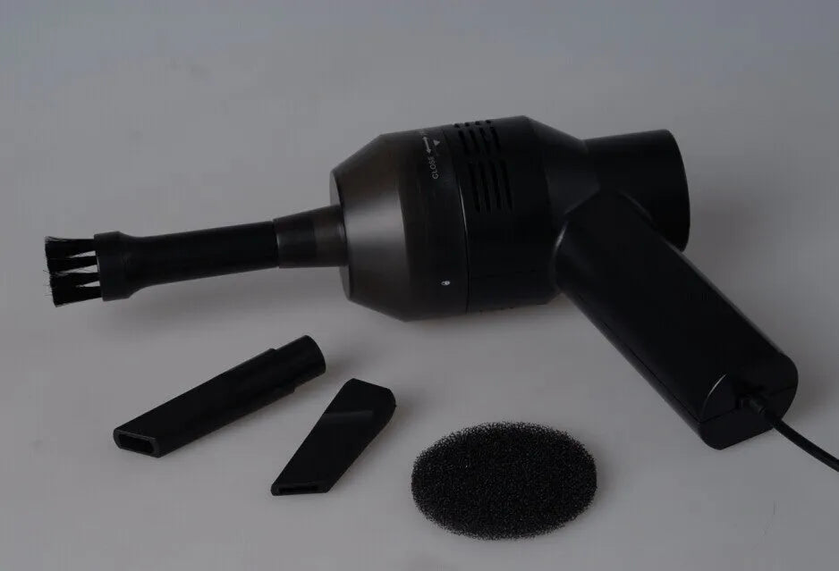 Black desktop mini vacuum cleaner with USB cable for keyboard and computer cleaning