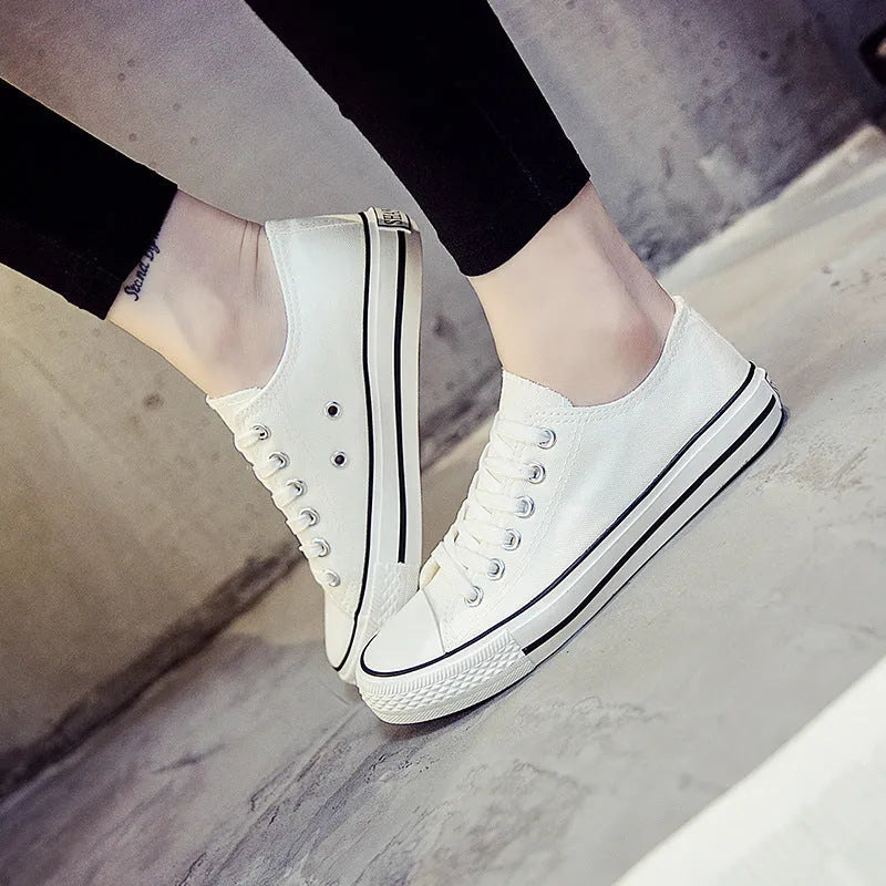 Women's casual canvas shoes in solid colours showing black, white black, white red and all black options