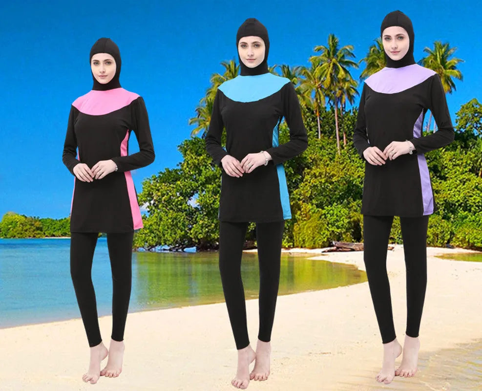 Conservative long sleeve hooded swimsuit top and pants set for women on a mannequin.