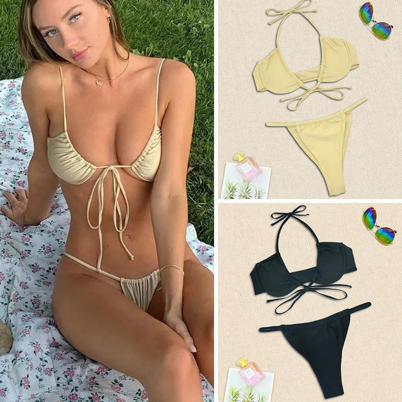 Women's two-piece black and mint green nylon bikini set on a mannequin.