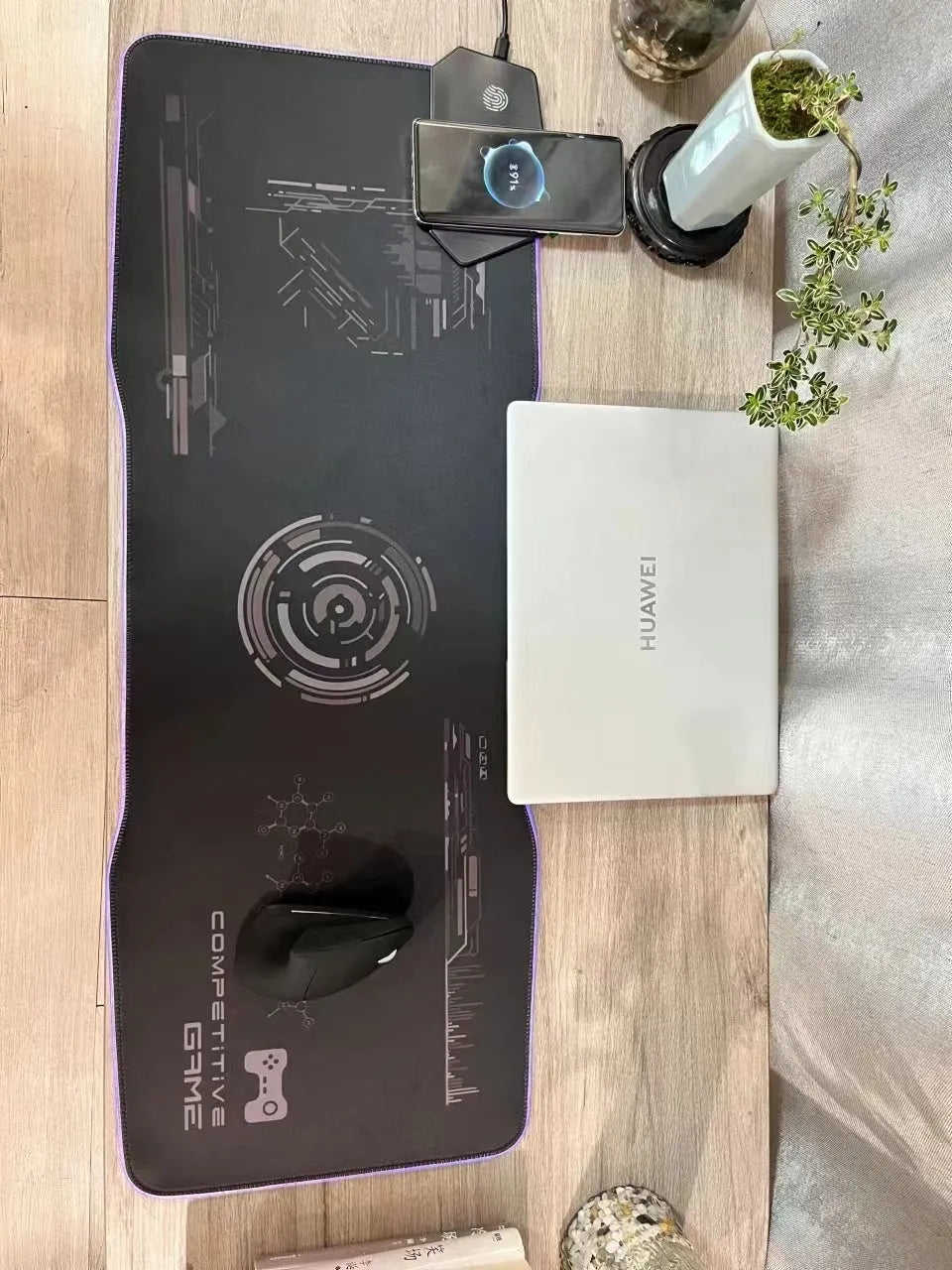 Black Mech-style cloth gaming mouse mat with luminous electric effect, showing TYPC port and non-slip rubber base.