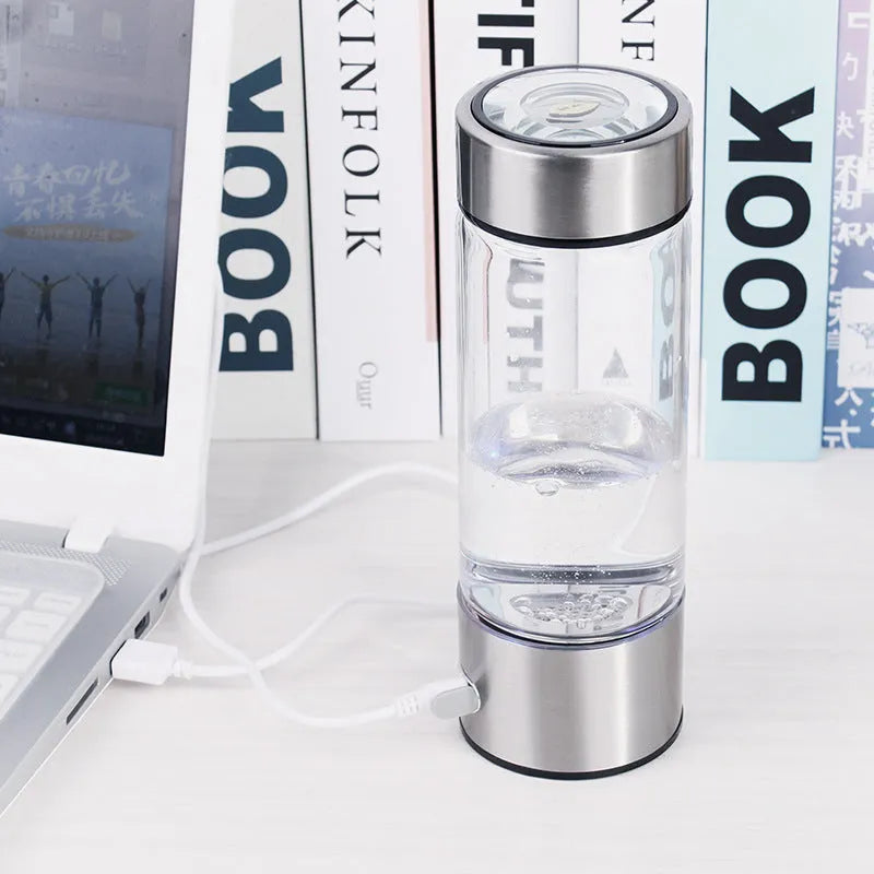 Silver electric hydrogen water bottle generator with borosilicate glass and rechargeable base