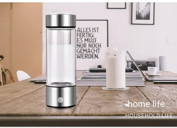 Silver electric hydrogen water bottle generator with borosilicate glass and rechargeable base