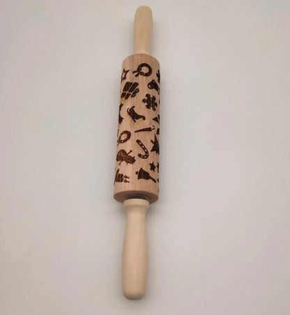 Personalized Christmas rolling pin with a variety of embossed holiday designs, including snowflakes, reindeer, and Merry Christmas patterns