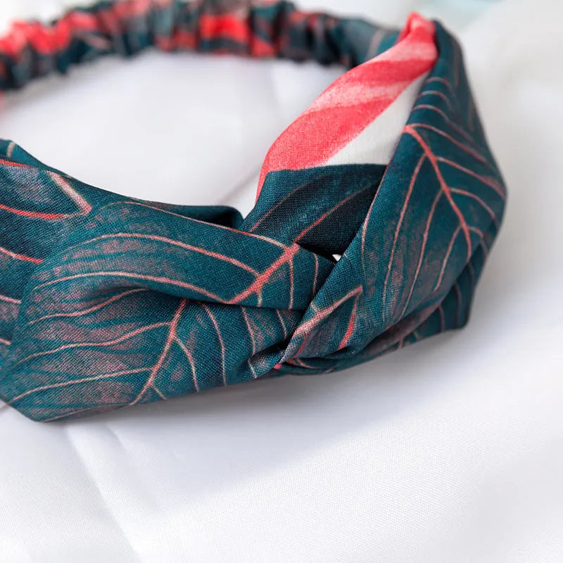 Red cloth women's headband with banana leaf cross pattern design for hair management
