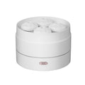 White ultrasonic aroma diffuser with four steam nozzles and LED light on a wooden table