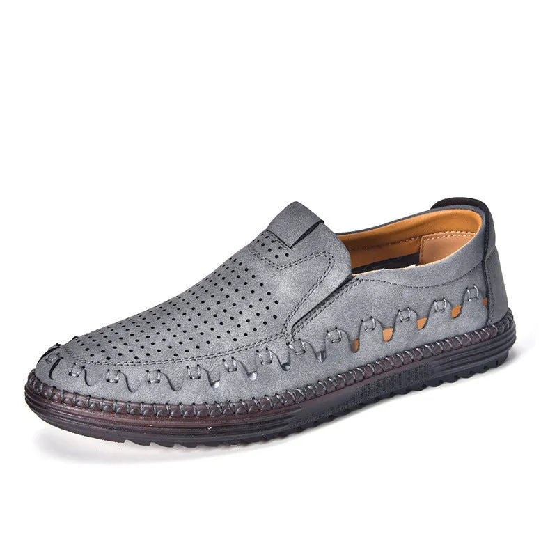 Men's brown slip-on casual shoes with a round toe and flat heel, showing hollowed-out design details.