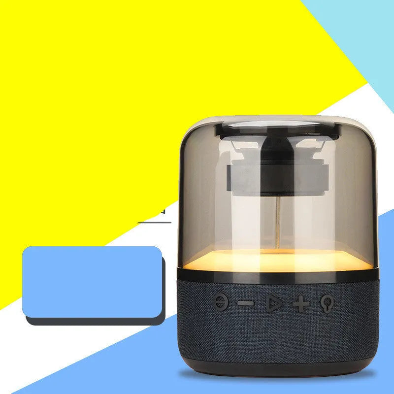 Four-colour light touch wireless Bluetooth speaker with control buttons and USB charging port.
