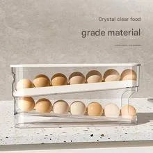Clear plastic slide-out egg tray dispenser holding 12 eggs on refrigerator side door shelf