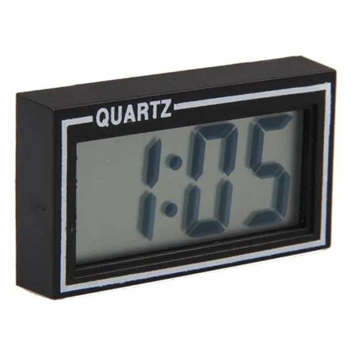 Battery-powered car clock with plastic case and ordinary glass mirror on a dashboard