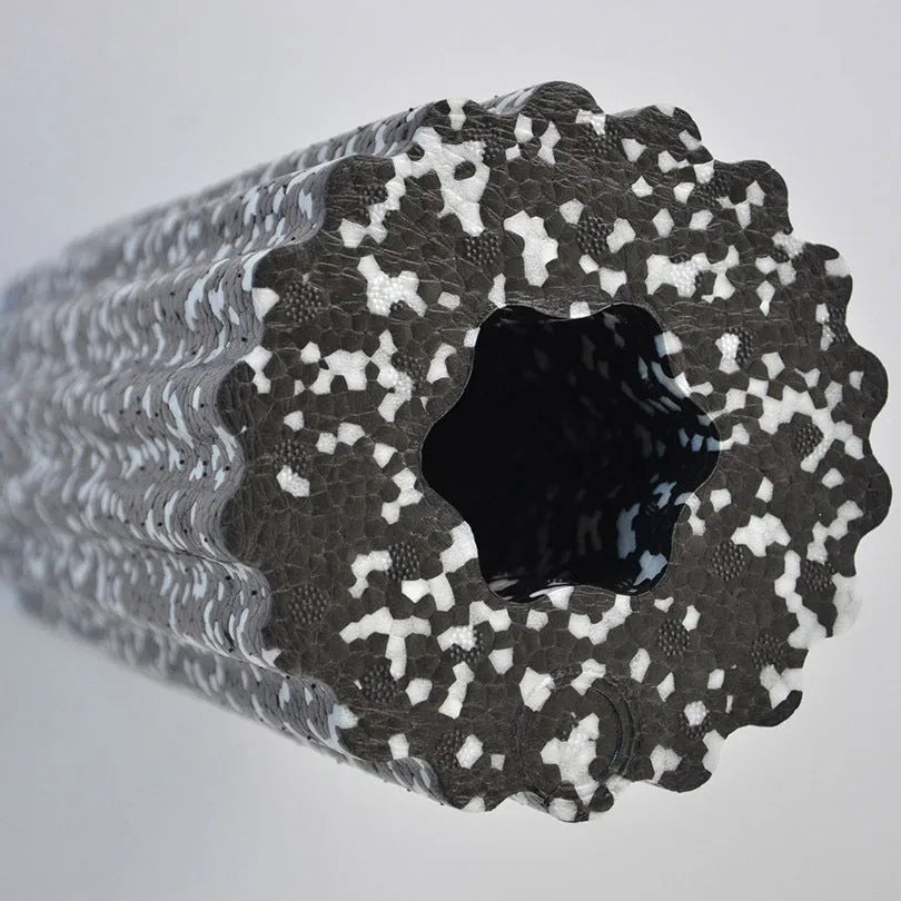 High density EPP foam roller 32 x 14 cm with quincuncial surface, shown in black and white for yoga and muscle massage.