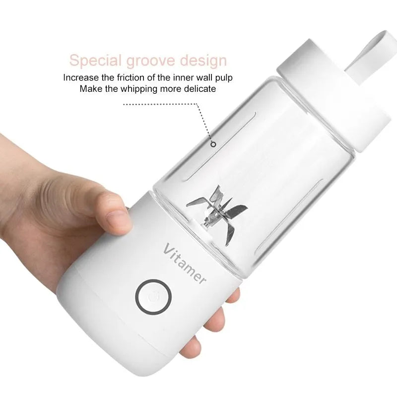 White portable USB blender bottle with silicone handle and stainless steel blade inside.