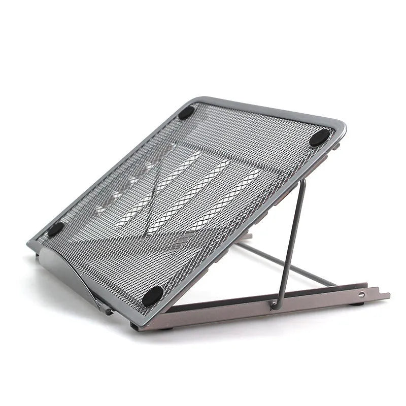 Adjustable folding laptop stand in silver, shown at an angle supporting a laptop.