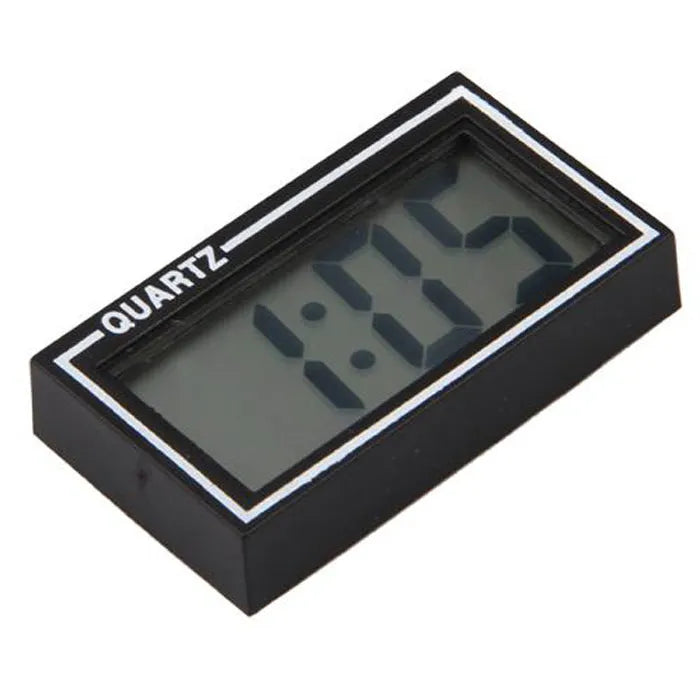 Battery-powered car clock with plastic case and ordinary glass mirror on a dashboard
