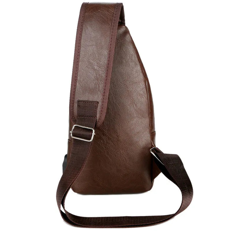 USB portable charging chest bag in PU leather with zipper closure, black colour, front pocket visible