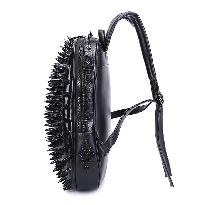 Black oval punk style backpack made of PU leather with silver zippers and air cushion shoulder straps.