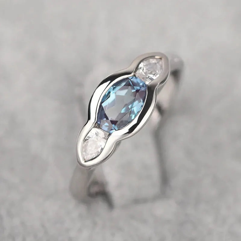 Women's geometric ellipse ring with inlaid zircon stones in white gold finish on copper
