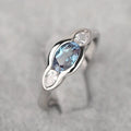 Women's geometric ellipse ring with inlaid zircon stones in white gold finish on copper