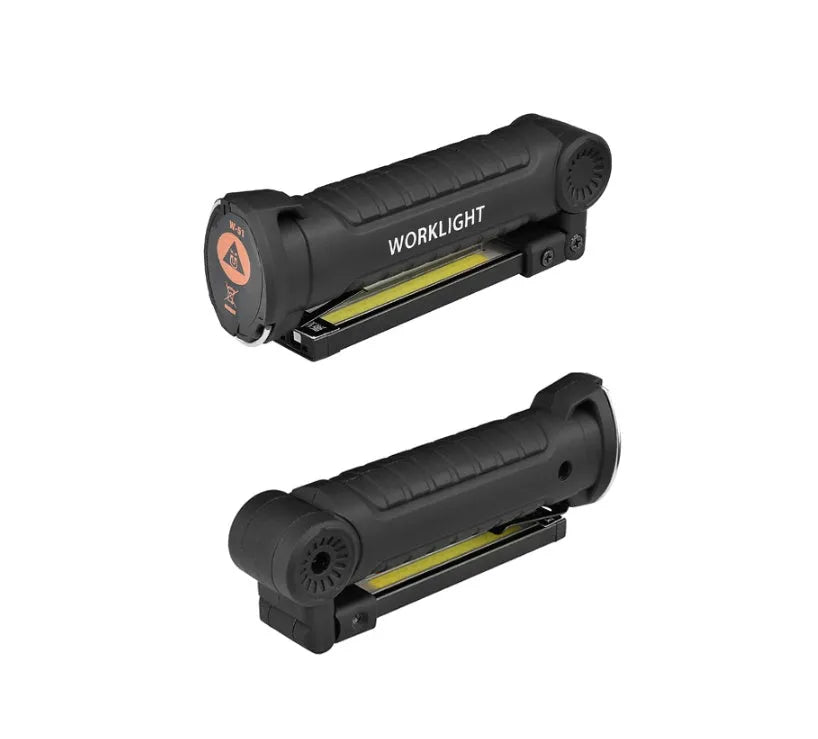 COB LED tactical flashlight in carbon-black finish with folding stand, magnet, and hanging hook on a metal surface
