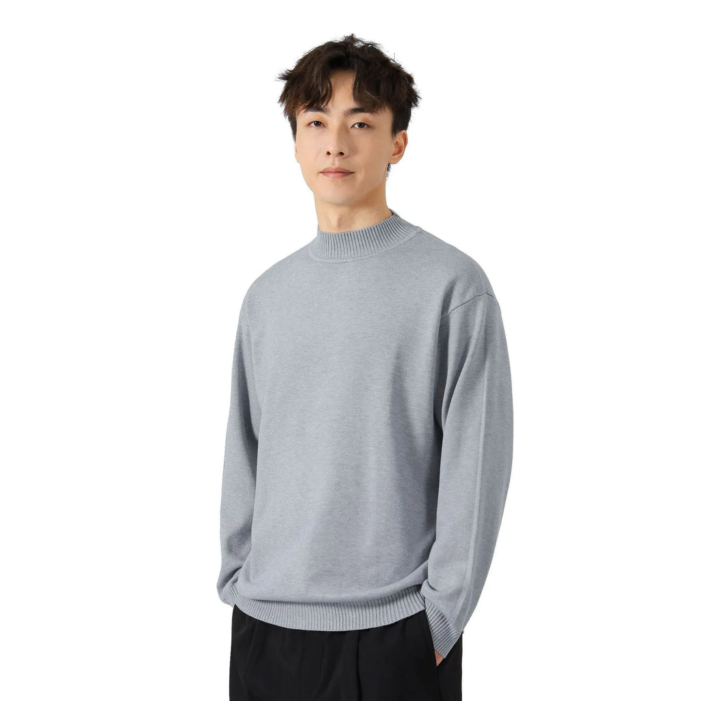 A man's loose-fitting solid colour long sleeve sweater in a chemical fibre viscose blend.