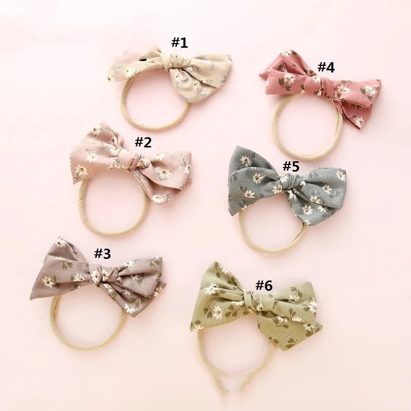 Children's cloth hair band with knotted bow design in one of six colour options featuring snow white princess printing