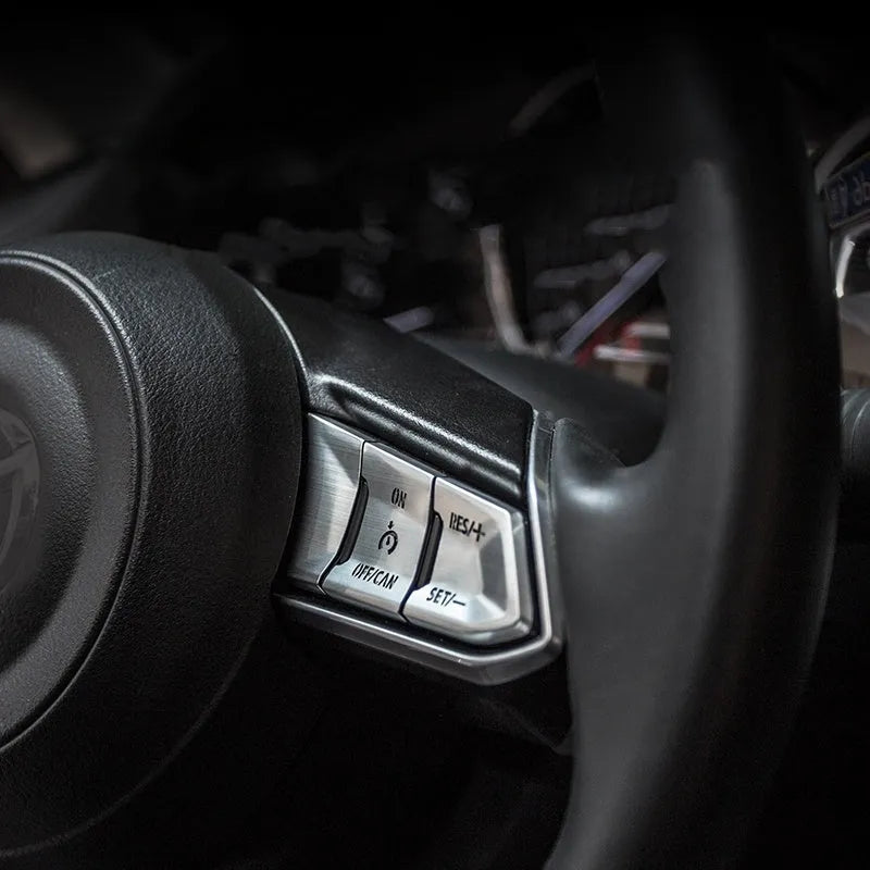 Aluminium alloy decorative steering wheel stickers with transparent button covers in brushed red, silver, and blue colours