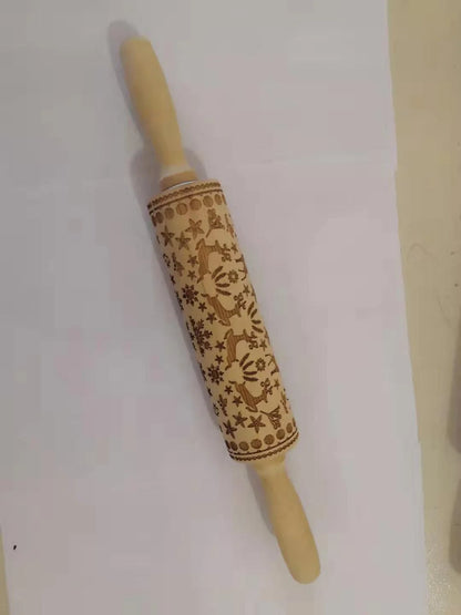 Personalized Christmas rolling pin with a variety of embossed holiday designs, including snowflakes, reindeer, and Merry Christmas patterns