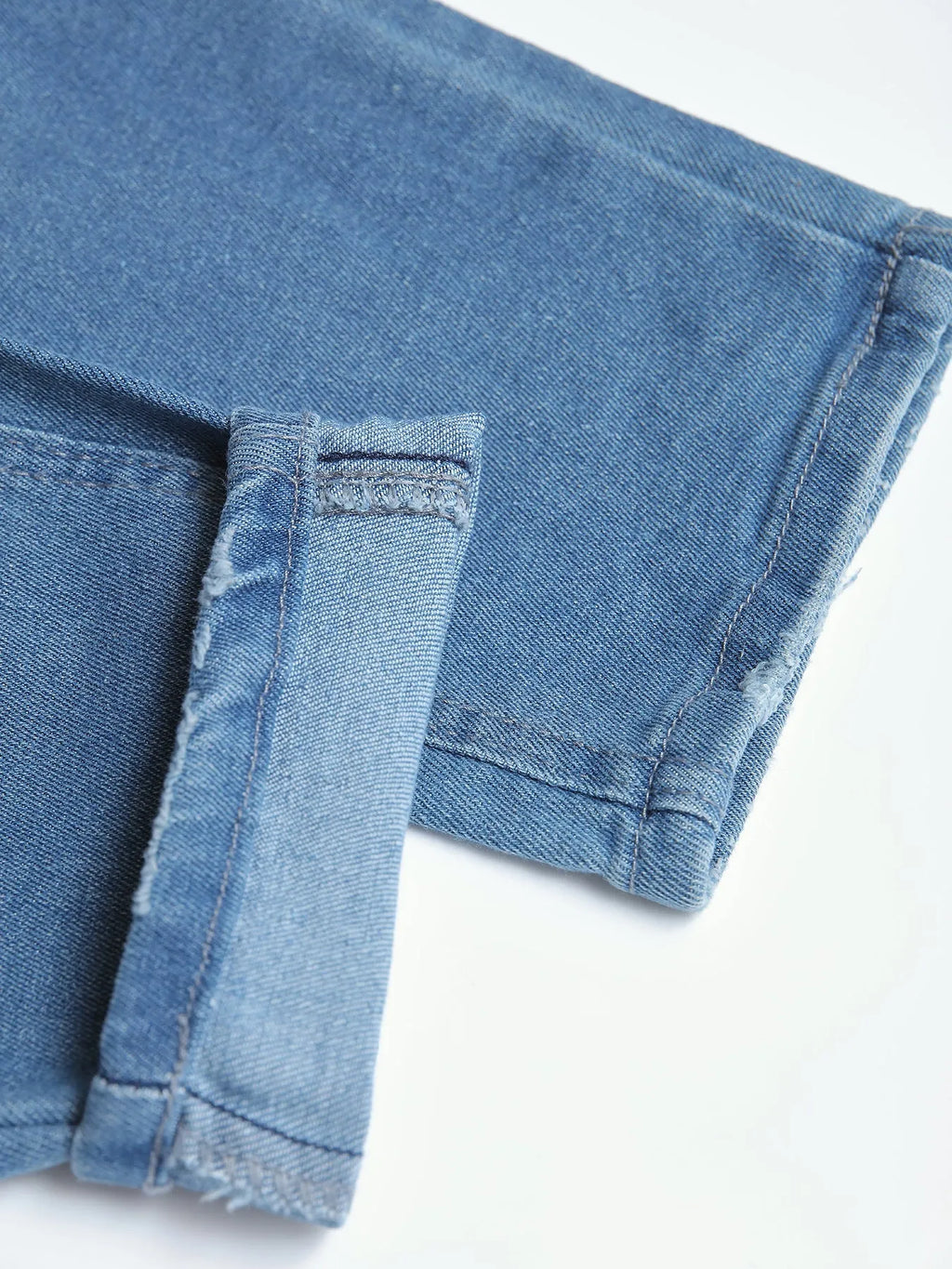 Men's blue denim skinny jeans with medium stretch, cotton fabric, side view on mannequin