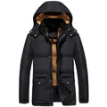 Man wearing a black loose-fit velvet double-breasted hooded winter jacket