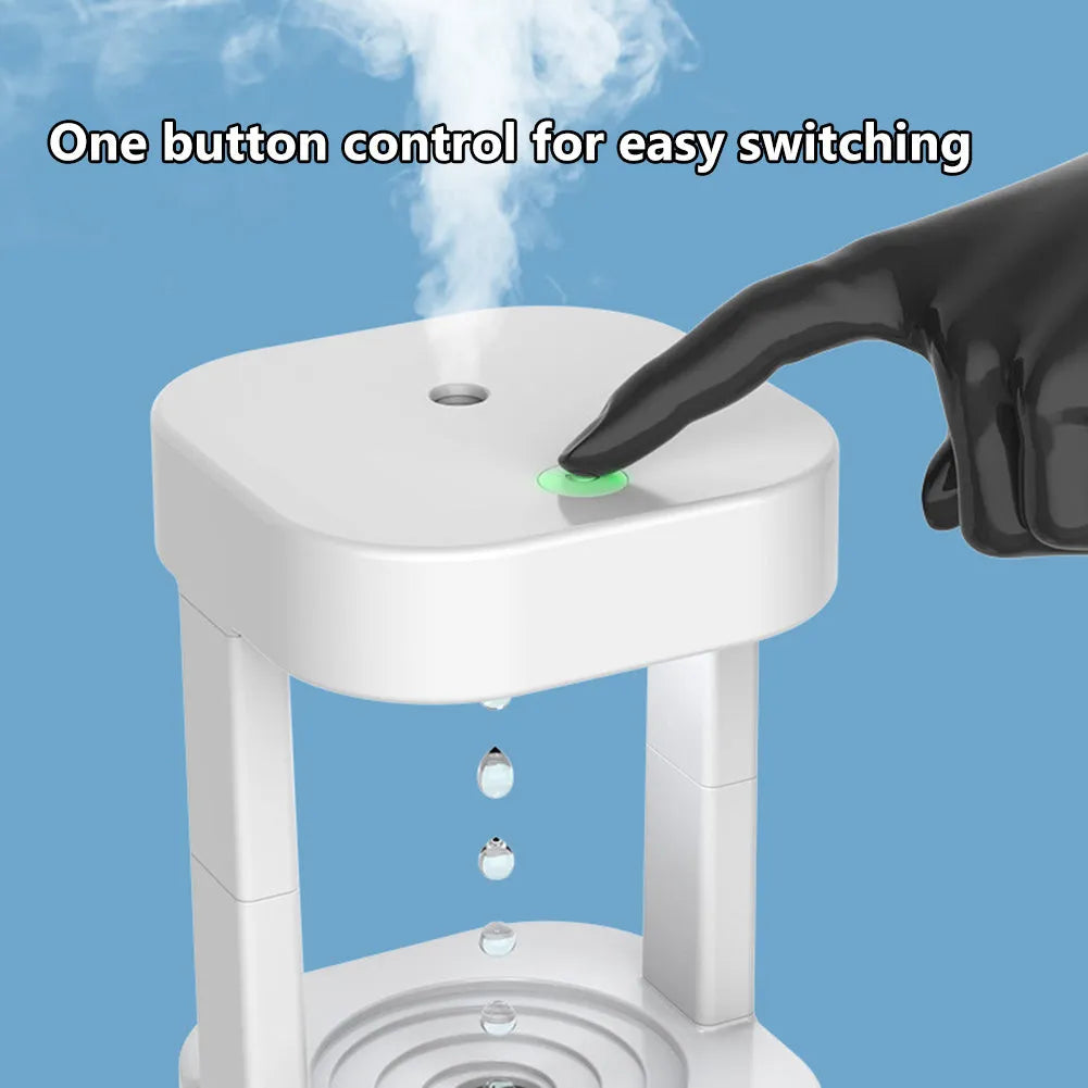 Anti-gravity water drop humidifier with coloured lights on a desk, showing water droplets appearing to float.