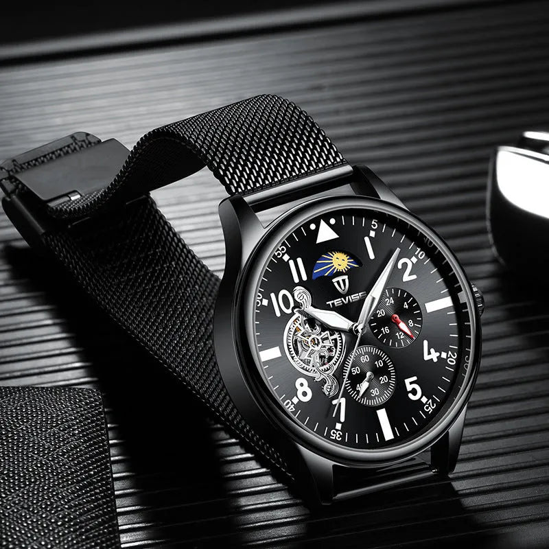 Men's black mechanical watch with moon phase complication and luminous hands on alloy case
