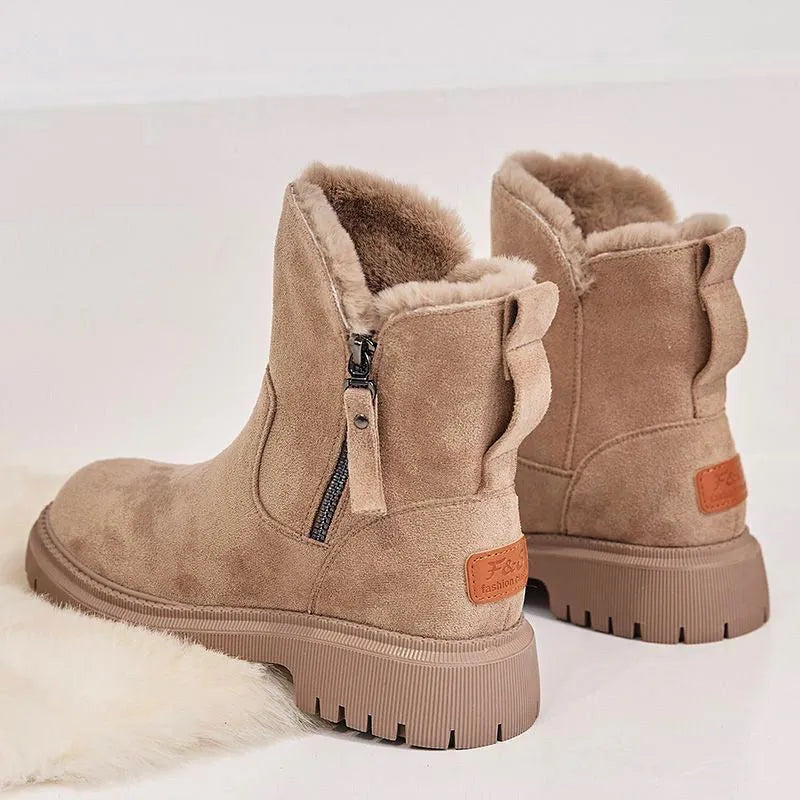 Women's black high-top snow boot with side zip, faux fur lining visible, and a rubber sole.