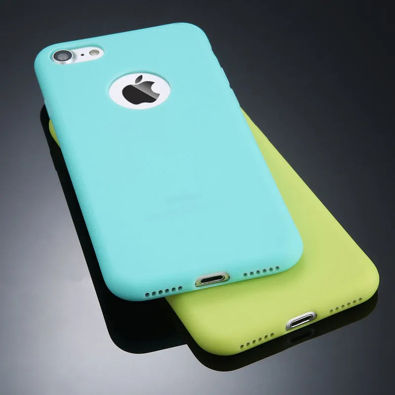 Soft silicon TPU iPhone case in a choice of candy colours on a table.