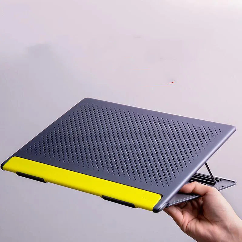 Portable black metal alloy laptop stand folded to 0.8mm thickness next to a notebook computer.