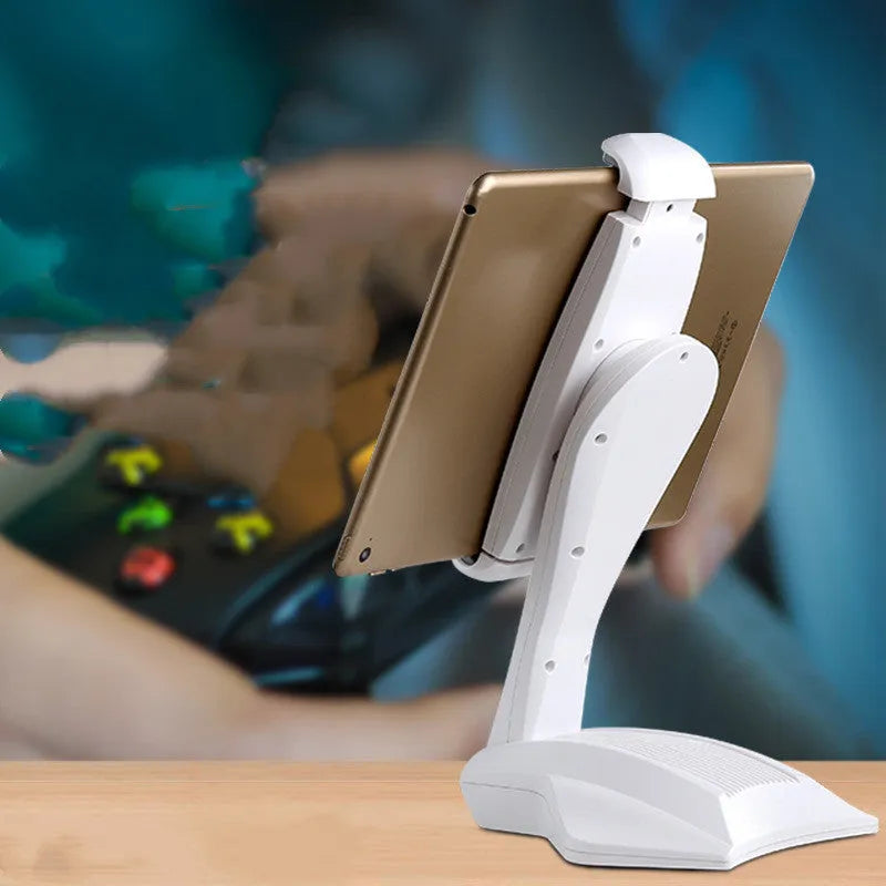 White adjustable tablet support stand with clip extended, holding a tablet on a desk.