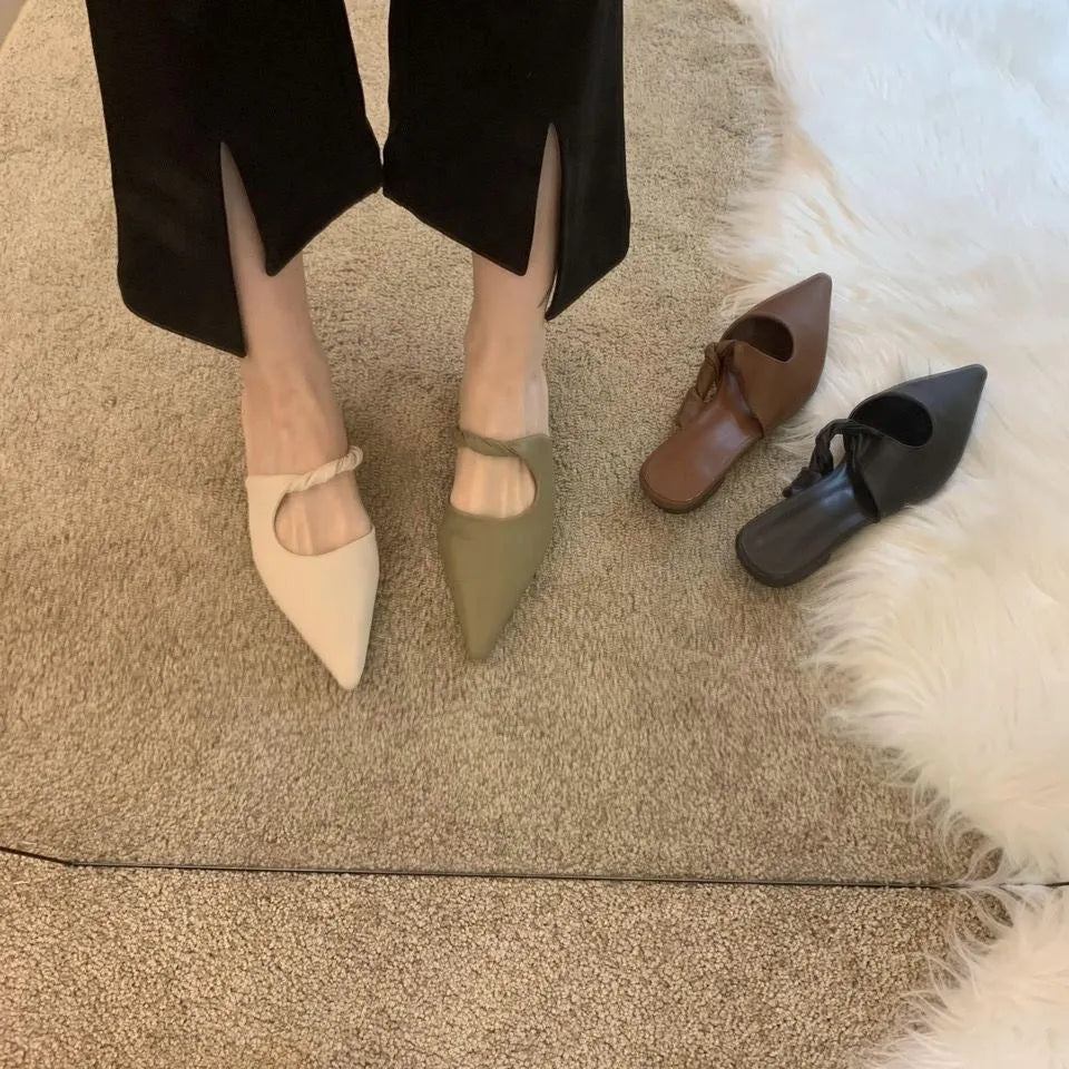 Women's soft leather slippers in dark brown with a semi-toe box design and rubber sole.