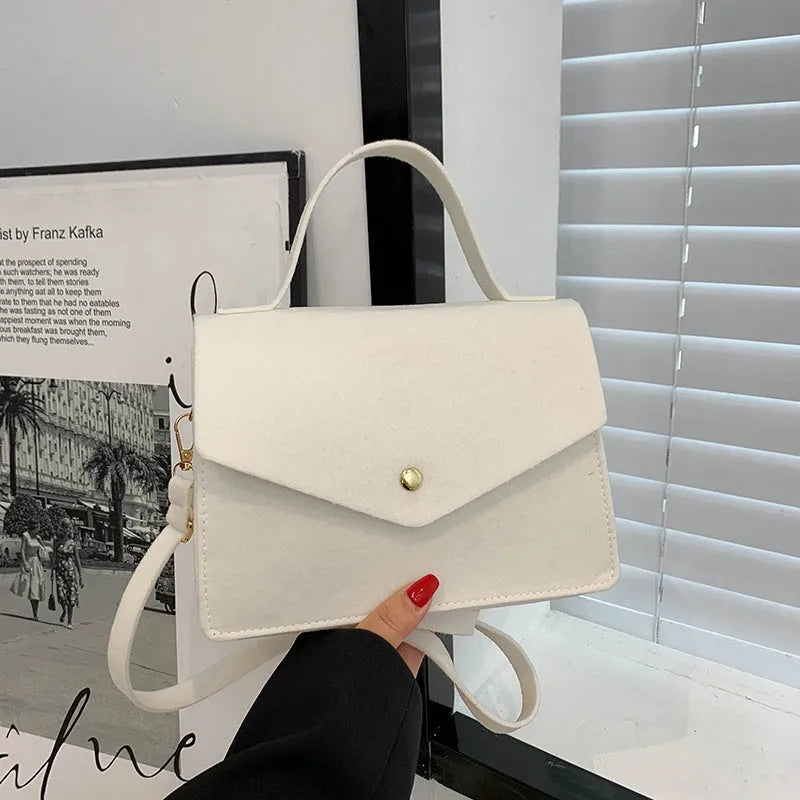 Women's non-woven shoulder messenger bag in white, compact size 22x15x8cm with long strap
