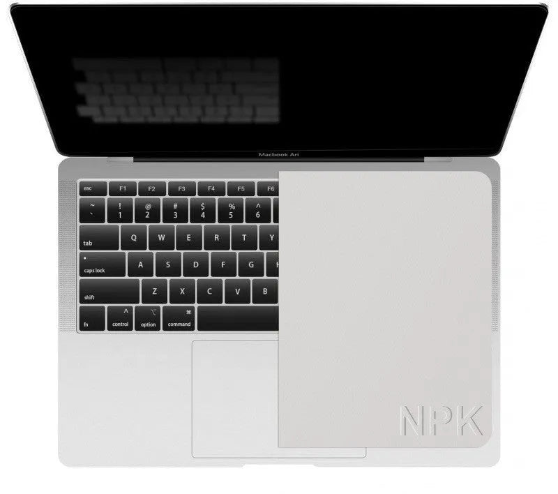 Grey keyboard dust cloth placed over a laptop keyboard for dust protection
