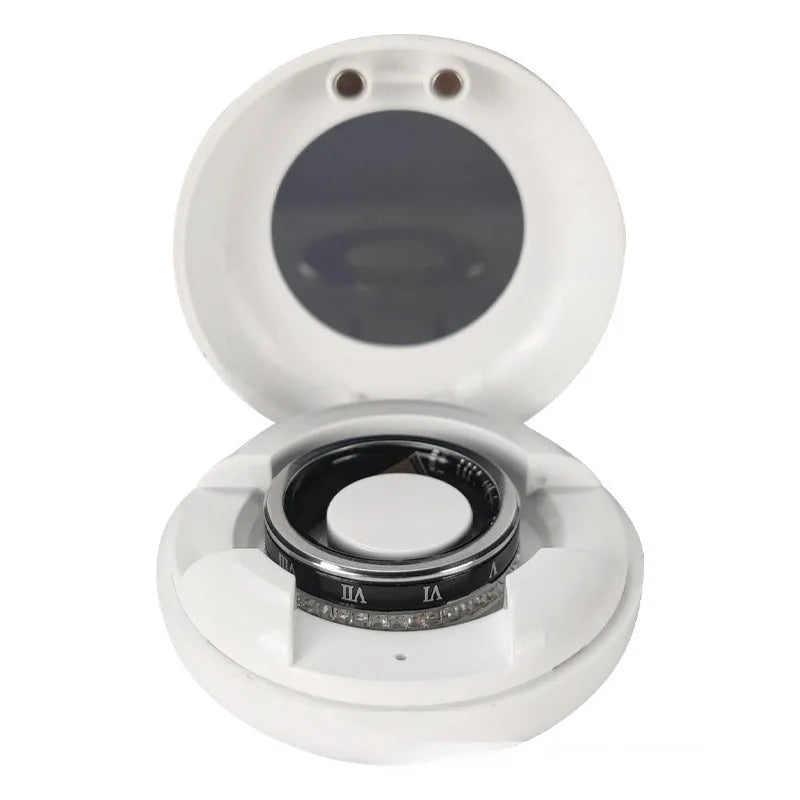Gold and silver diamond inlaid smart ring for health and blood oxygen tracking on a finger.