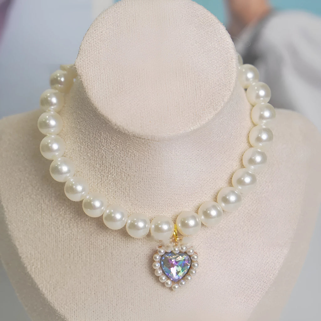 A decorative gem-style cat collar in plastic alloy resin, shown in multiple solid colours with adjustable sizing.