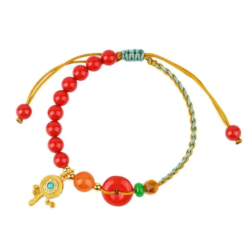 Hand-woven cinnabar peace blessing bracelet in emperor red sand colour with geometric national style design