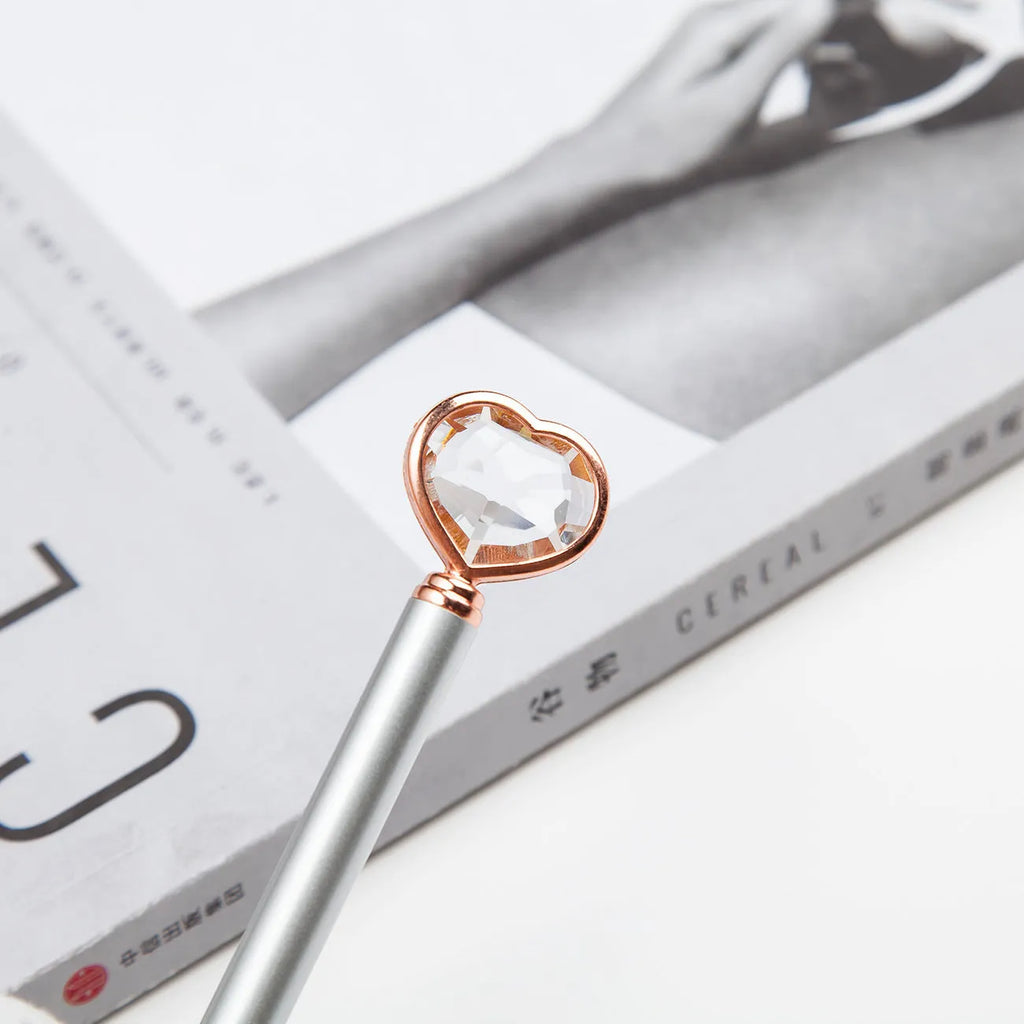 Creative Crystal Love Ball Diamond Metal Pen in gold, rose gold, and silver colours.